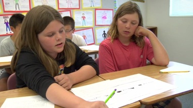 Two students working together on a classroom activity