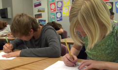 Two students are writing